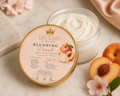Blushing Peach Body Butter - open jar on marble